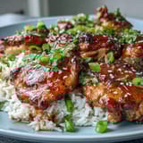 2. Tender chicken in rich honey garlic glaze paired with aromatic basmati rice, perfect for an easy weeknight dinner.  